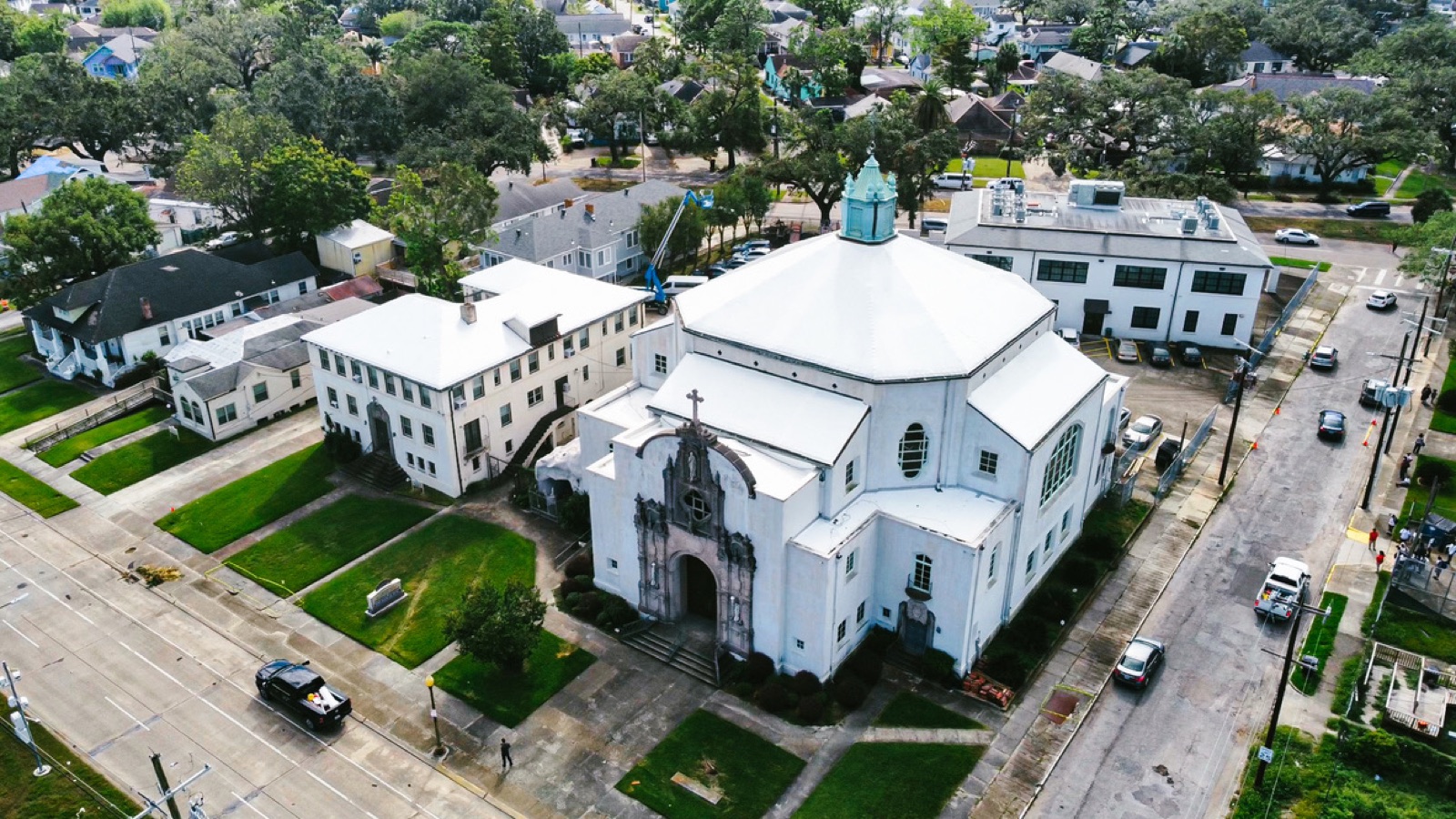 Historic New Orleans church and school campus under shrink wrap roof protection