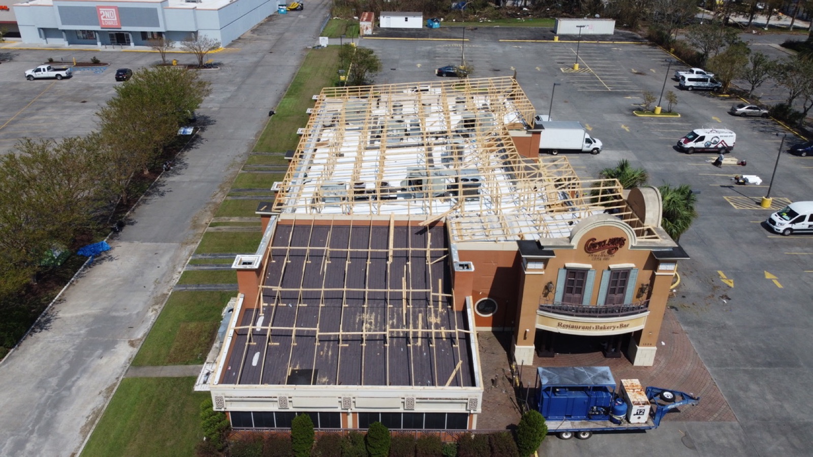 Restaurant with its roof structure destroyed by a hurricane before shrink wrap protection