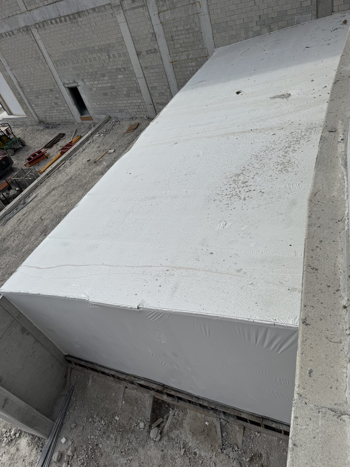 Titanium Tarps film wrapping a massive stadium canopy element